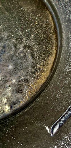 Visible gold in panning dish from hole FKGRC184
