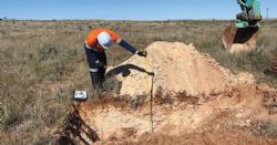 – Geotechnical consultant logging a shallow test pit
