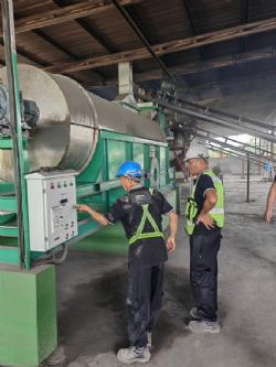 Figure 2: The PYX team inspecting the installation of a new dryer machine 