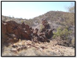 Figure 5 Prominent ferruginous ridge with copper occurrences west of Rockface and location of drill holes JOC142‐3