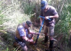 Taking Auger Samples from the Tailings