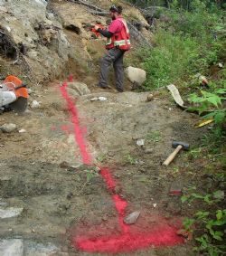 Figure 6. Excavation and preparation for channel sampling on the Root Lake pegmatite. 
