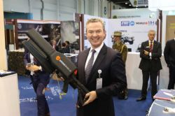The Honourable Christopher Pyne MP (Australian Minister for Defence Industry) at the 2017 International Defence Exhibition and Conference (IDEX) (in Abu Dhabi), holding DroneGun.