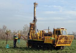 Track-mounted air-core rig drilling shallow exploration holes on “black-soil” plains in the Grants region, Finniss Lithium Project NT.