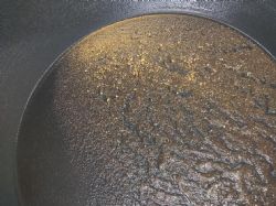 Panned concentrate of drillhole PTAC492 10-12m showing extensive coarse gold recovered.